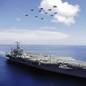USS Abraham Lincoln and aircraft perform a aerial demonstration