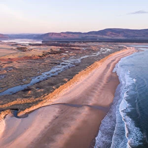 Aerial view of coastline and Coul Links sand dune system at sunrise, Sutherland, Scotland, North Sea, UK. March, 2020