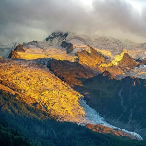 Aiguille De La Gliere and Aiguille de la Floria mountians, with sunset light on alpine glaciers, Chamonix, French Alps. July