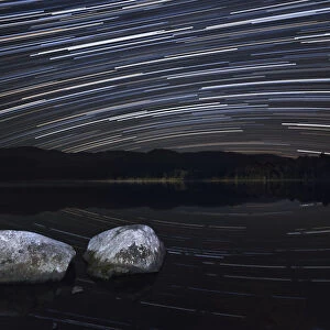 Night sky over Loch Morlich with star trails, Cairngorms National Park, Cairngorms