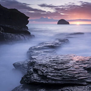 Sunset at Trebarwith Strand with incoming tide, North Cornwall, UK. March 2014