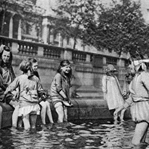 Children paddling in the fountains at Trafalgar Square, London, 1926-1927. Artist: Whiffin