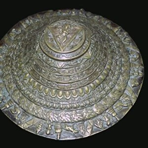 Circular plaque from Nepal with dancing figure, probably Chamunda