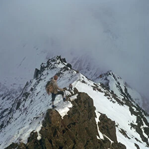 Climber on Crib Goch ridge on Snowdon