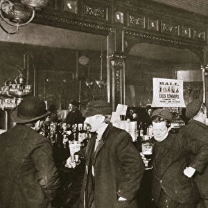 Customers drinking in a bar in the Bowery, New York City, USA, 1900s