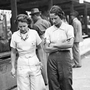 Elsie Wisdom (right) with Kaye Petre in pits at Brooklands. Creator: Unknown