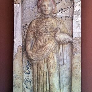 Greek stele of a girl holding a bird, 4th century BC
