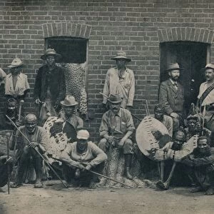 A Group of Afrikaners and Zulus, c1900. Creator: Unknown