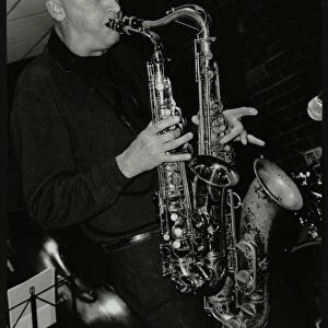 Kelvin Christiane playing two saxophones at The Fairway, Welwyn Garden City, Hertfordshire, 2002