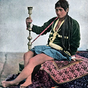 Persian woman smoking in Kalgan, c1890
