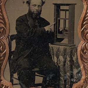 Seated Man Demonstrating Vertical Sliding Window Model, late 1850s-60s. Creator: Unknown