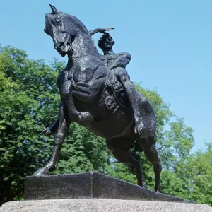 Physical Energy Print: A bronze statue of a nude male figure in mid-leap