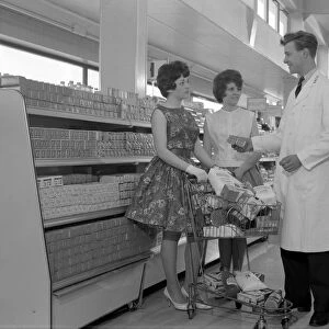 Supermarket shoppers and salesman, Co-op, Barnsley, South Yorkshire, 1961. Artist