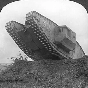 A tank breaking through the wire at Cambrai, France, World War I, c1917-c1918. Artist: Realistic Travels Publishers