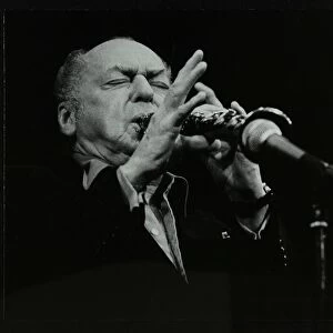 Woody Herman playing his clarinet at the Forum Theatre, Hatfield, Hertfordshire, 24 May 1983