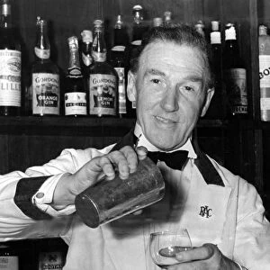 Barman mixing a cocktail