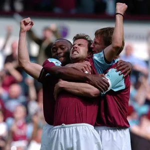 Carl Fletcher of West Ham is congratulated on his goal by team-mates Nigel Reo Coker and Teddy Sheringham