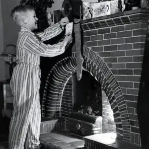1954 Christmas Print: Boy Hanging Stocking by Fireplace 1954 Christmas Print: Boy Hanging Stocking by Fireplace