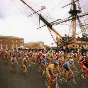 Tour de France cycle race passes through Portsmouth with HMS Victory in background