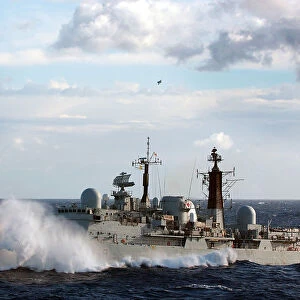 HMS Exeter is shown towing the splash target for the bombing runs of the Sea Harriers