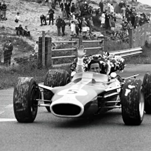 1967 Dutch Grand Prix. Zandvoort, Holland. 4 June 1967. Jim Clark, Lotus 49-Ford, 1st position, celebrates victory, action. World Copyright: LAT Photographic Ref: L67/378/32A