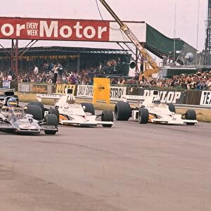 1973 British Grand Prix: Ronnie Peterson leads Denny Hulme and Peter Revson at the start