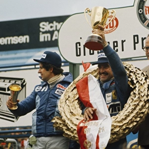 1974 German Grand Prix - Podium: Clay Regazzoni, 1st position, Jody Scheckter, 2nd position and Carlos Reutemann, 3rd position, celebrate on the podium