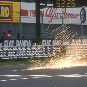 1990 Italian Grand Prix: A benetton B190 Ford sends up a shower of sparks