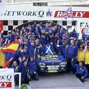 1995 World Rally Championship. Lombard RAC Rally, Great Britain. 19-22 November 1995. Colin McRae/Derek Ringer (Subaru Impreza 555), 1st position. Celebrating on the podium with Prodrive team principal David Richards and the team. World Copyright