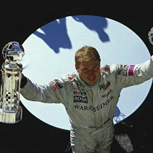 2001 United States Grand Prix. Indianapolis, Indiana, USA. 28-30 September 2001. Mika Hakkinen (McLaren Mercedes) celebrates his 1st position on the podium. Ref-01 USA 23. A Race Through Time exhibition number 25. World Copyright - Clive Rose/LAT