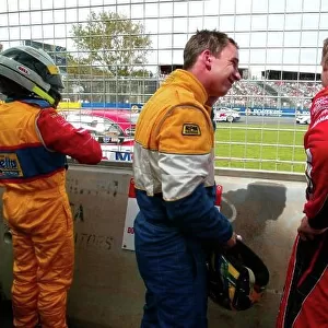 2003 Australian V8 Supercars Melbourne Grand Prix, Victoria, Australia 9th March 2003 Holden drivers Todd Kelly (R) paul Weel (C) and Ford driver Paul Radisich are sidelined after a crash at the strat of race 1 of the V8 Supercars at the 2003