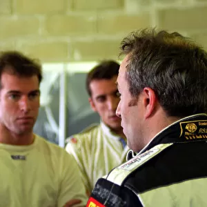 2004 Le Mans Pre-Qualifying, La Sarthe, France. 23rd - 25th April. Racing for Holland Dome/Judd team mates Ralf Firman and Justin Wilson talk to Tom Coronel in the garage. World Copyright: Brooks/LAT Photographic ref: Digital Image only