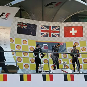 2014 GP3 Series Round 6. Spa-Francorchamps, Spa, Belgium. Sunday 24 August 2014. Alex Lynn (GBR, Carlin) celebrates his win on the podium with Richie Stanaway (NZL, Status Grand Prix) and Alex Fontana, (SUI, ART Grand Prix)