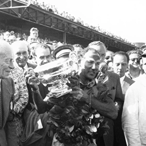 Aintree, Great Britain. 1955: Race winner Stirling Moss, podium