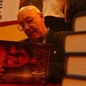 Autosport International Show: TV Legend Murray Walker signs copies of his autobiography on the F1 Racing stand