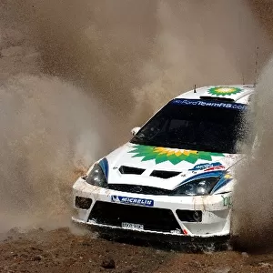 FIA World Rally Championship: Francois Duval / Stephane Prevot Ford Focus WRC 03 who finished 2nd goes through a watersplash