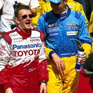 Formula One World Championship: Allan McNish Toyota, left, shares a joke with Jenson Button, Renault, right