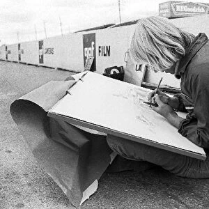 Formula One World Championship: An artist draws the McLaren M23 of race winner Peter Revson in the pits