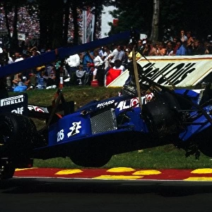 Formula One World Championship: The Ligier JS27 of Jacques Laffite is carried away after a start line crash that sadly ended Laffite├òs F1 career