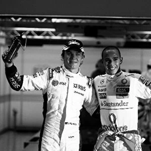 Formula One World Championship: third placed Nico Rosberg Williams and pole sitter Lewis Hamilton McLaren in parc ferme