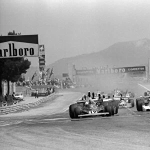 Formula One World Championship: Race winner Niki Lauda Ferrari 312T leads at the start of the race