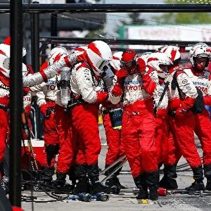Formula One World Championship: The Toyota team await a pit stop
