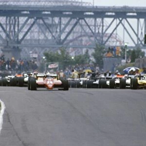 Montreal, Canada. 13 June 1982: Didier Pironi, Ferrari 126C2, 9th position, and Rene Arnoux, Renault RE30B, retired, leave on the parade lap, action
