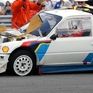 Silverstone Classic: Peugeot 205 T16 Rally Car is rolled back onto its wheels after rolling during a demonstration