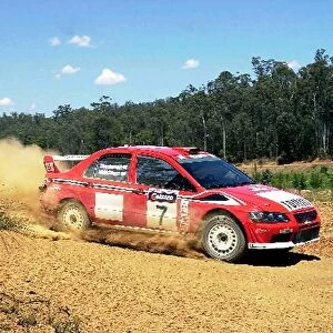 World Rally Championship: Tommi Makinen Mitsubishi Lancer EVO VII kicks up the dust on stage 2. Day one