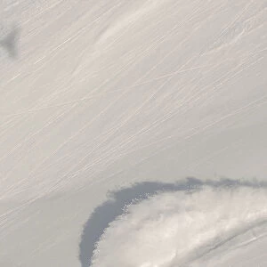 Aerial View Of Snowboarder On Snowy Slope; Haines, Alaska, United States Of America