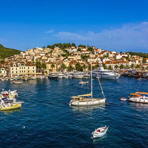 Boats anchored in harbour and marina in front of Old Town of Hvar on Hvar Island, Croatia
