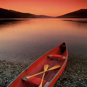 Canoe At Edge Of Mountain Lake, Shuswap, British Columbia, Canada