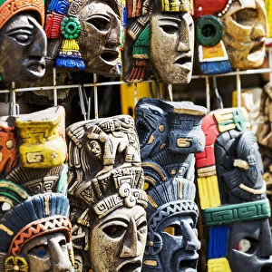 Close Up Of Colourfully Painted Mayan Masks Hanging On Display; Akumal, Quintana Roo, Mexico