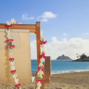 Hawaii, Oahu, Kailua, A lounge chair on the white sandy beach of Lanikai